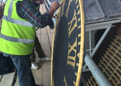 Man Restoring Clock Template